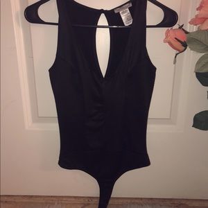 Form fitting black bodysuit